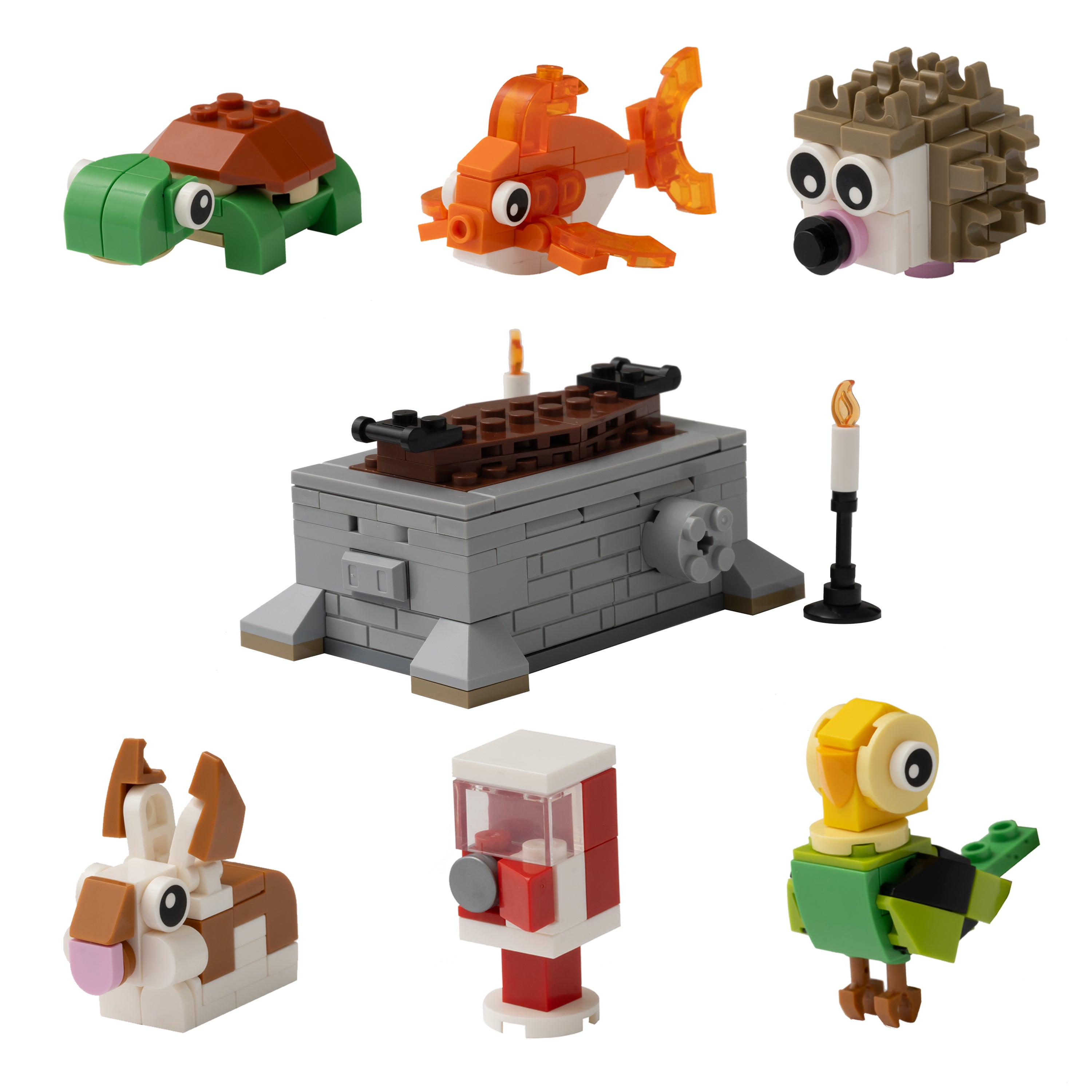 Collection of small toy figures and a miniature grave on a white background