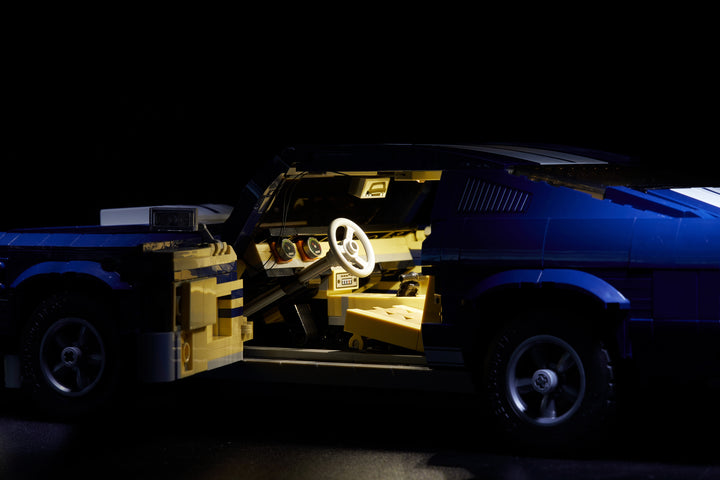 Close-up of the blue LEGO Ford Mustang set 10265, with the custom Brick Loot LED Light kit installed.
