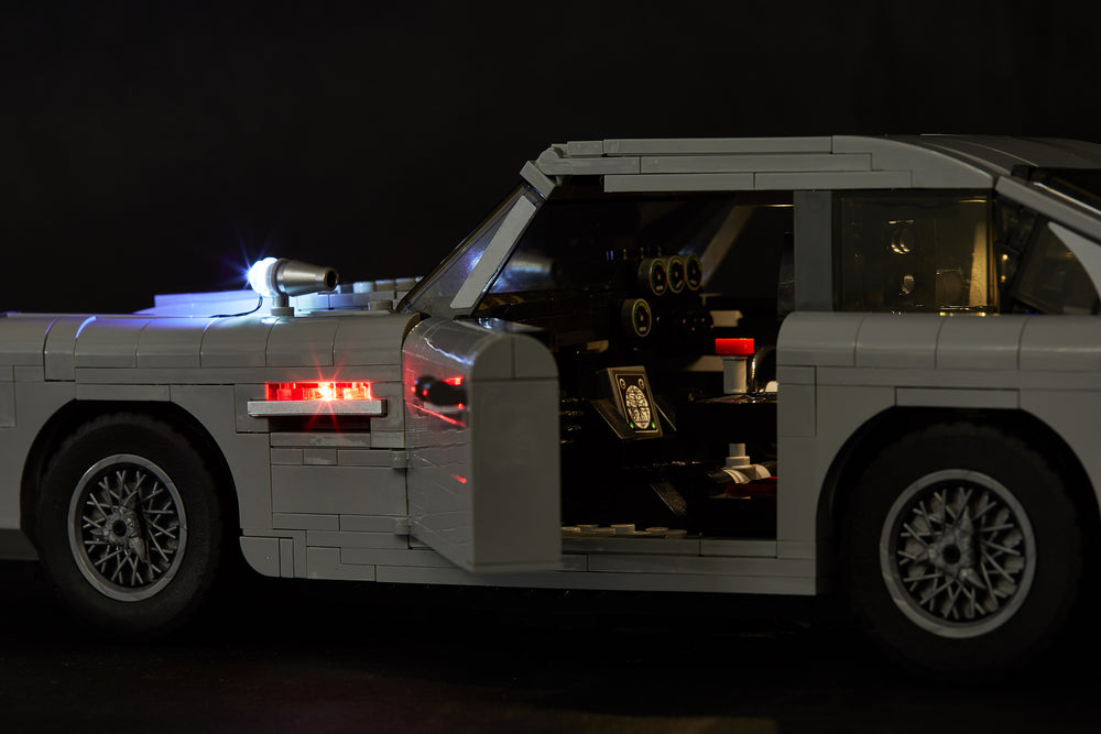 Side view of the LEGO James Bond Aston Martin DB5 model - set 10262; the interior and exterior is illuminated with the Brick Loot custom LED light kit.
