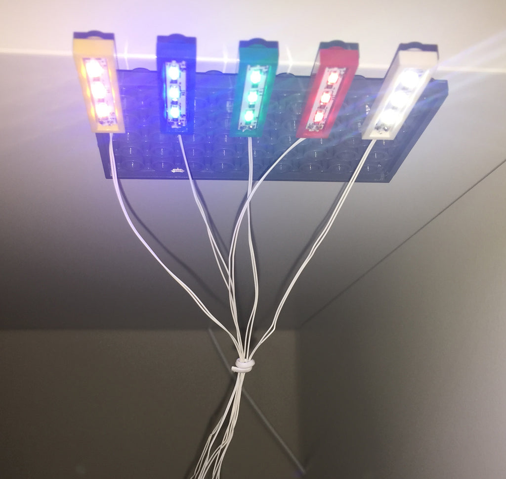 Brick Loot Light Kit for LEGO - 1x4 Brick Down Lights in White/White LED, Red/Red LED, Green/Green LED, Blue/Blue LED, Yellow/yellowish-tint LED; all USB-powered. Each sold separately OR as a 5-pack.