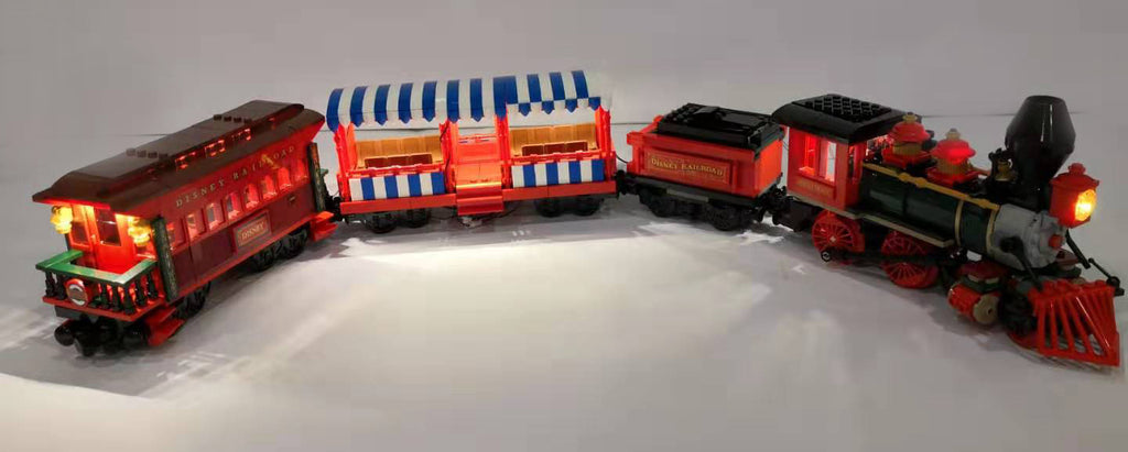 LEGO Disney Train, completely lit up with the Brick Loot LED Light Kit. The train is a part of the LEGO Disney Train and Station set 71044.