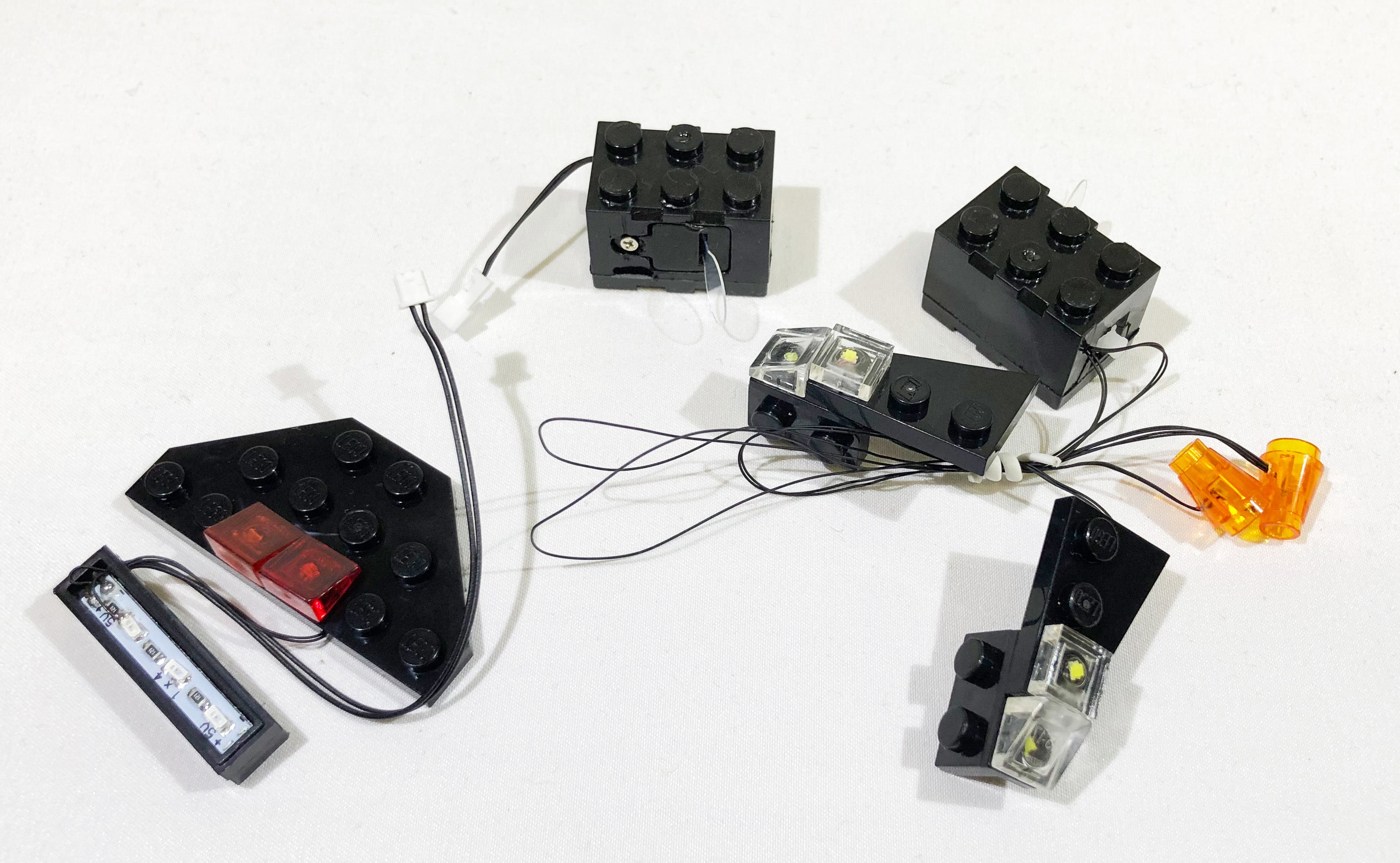 Brick Loot LED Lighting Kit light strings and battery bricks, custom-designed for the LEGO App-Controlled Batmobile set 76112.