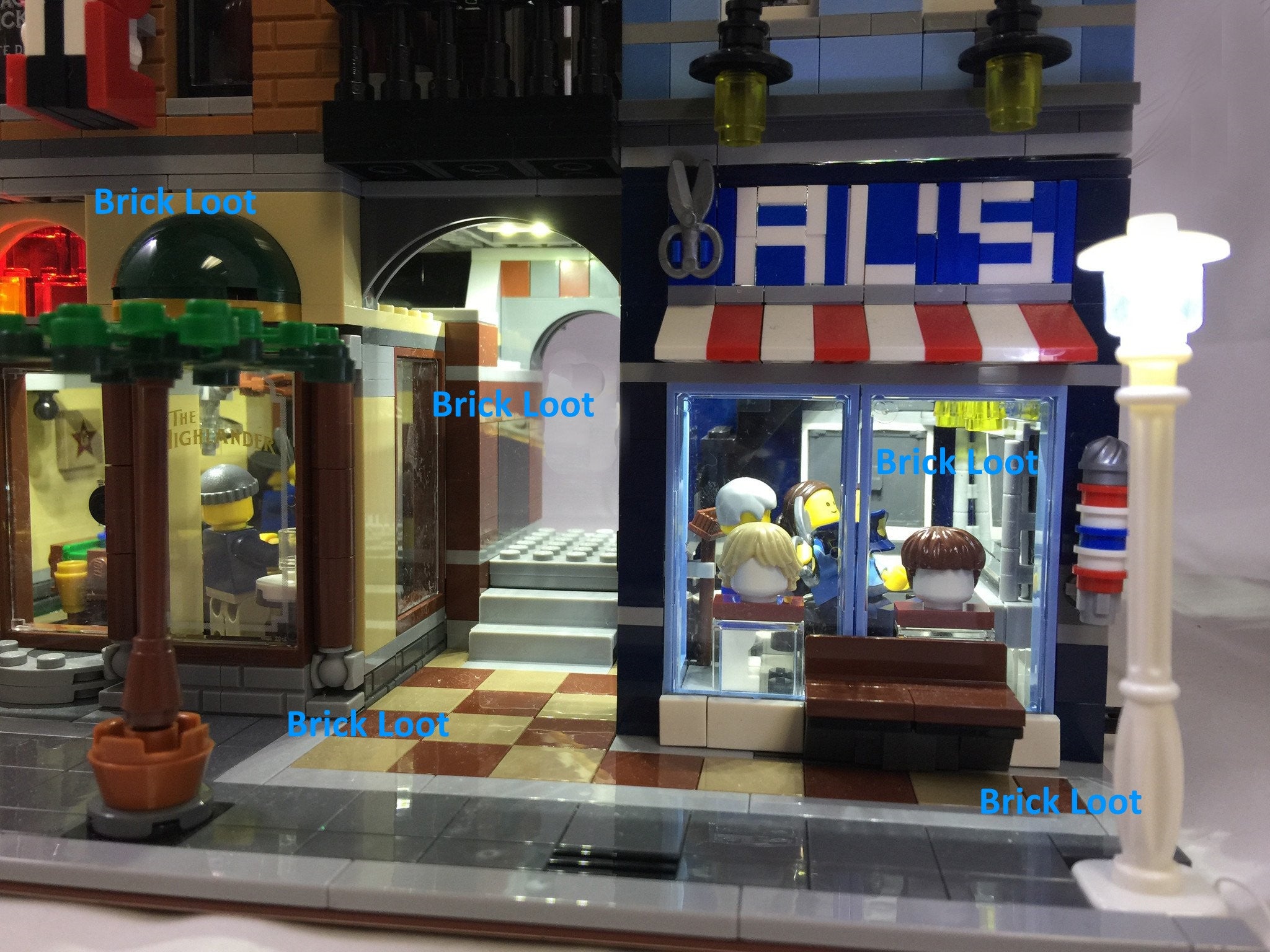 Close up of LEGO Creator Detective's office set 10246 with the Brick Loot 4 white plates 1x4 white down lights LED Kit installed (powered through USB)