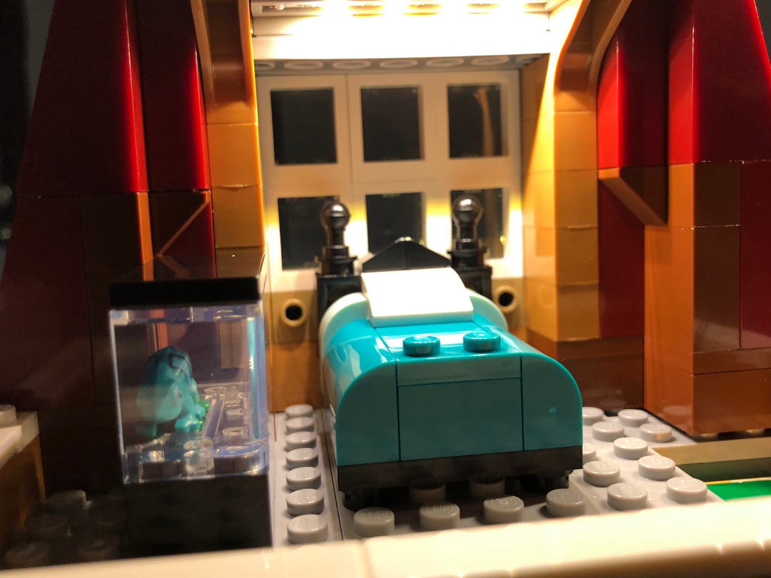 Close-up of an interior room of the LEGO Creator Expert Bookshop set 10270 with the Brick Loot custom LED Light kit installed.