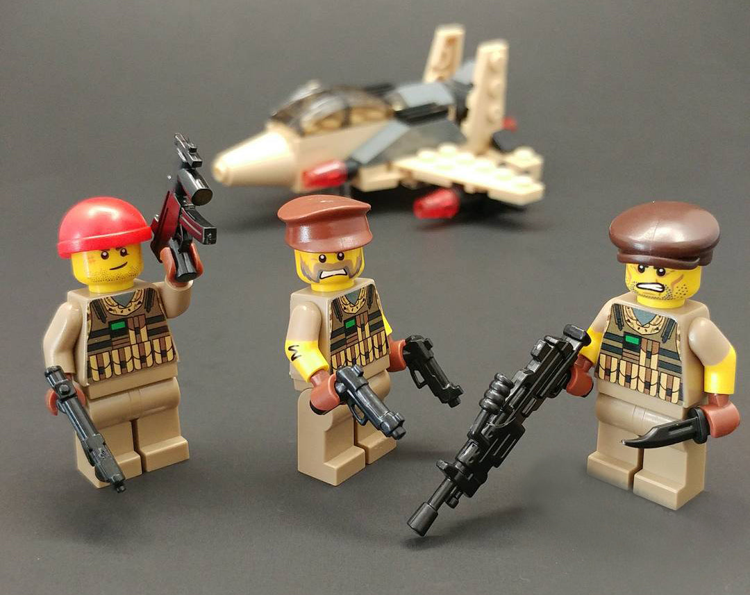 Brick Loot Exclusive LEGO Minifigures and Mega 86 Pack LEGO Compatible Minifigure Weapons and military plane in the background (allsold separately)