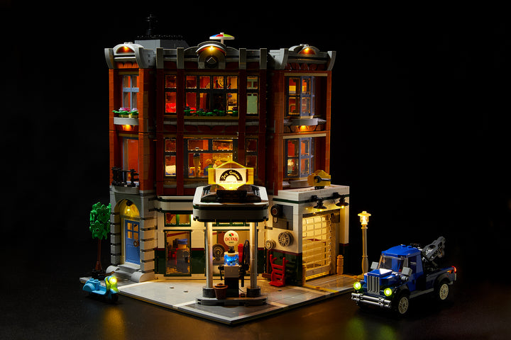 LEGO Corner Garage set 10264, fully illuminated with the Brick Loot custom light kit with 116 LEDs to light up the inside, the exerior, and the tow truck and scooter!