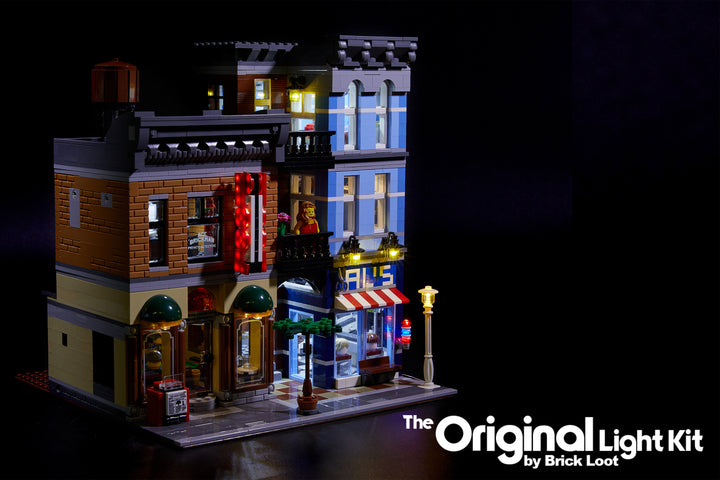Close-up view of the custom Brick Loot light kit installed on the LEGO Detective's Office and Barbershop set 10246. The extra POOL sign and barbershop light are shown here.  