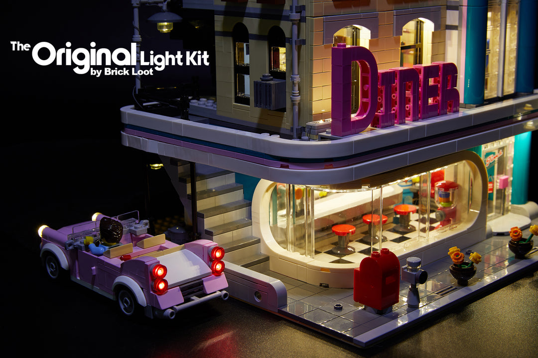Close up of the LEGO Downtown Diner set 10260, brilliantly illuminated with the Brick Loot LED light kit! The Brick Loot light kit includes lights for the car!