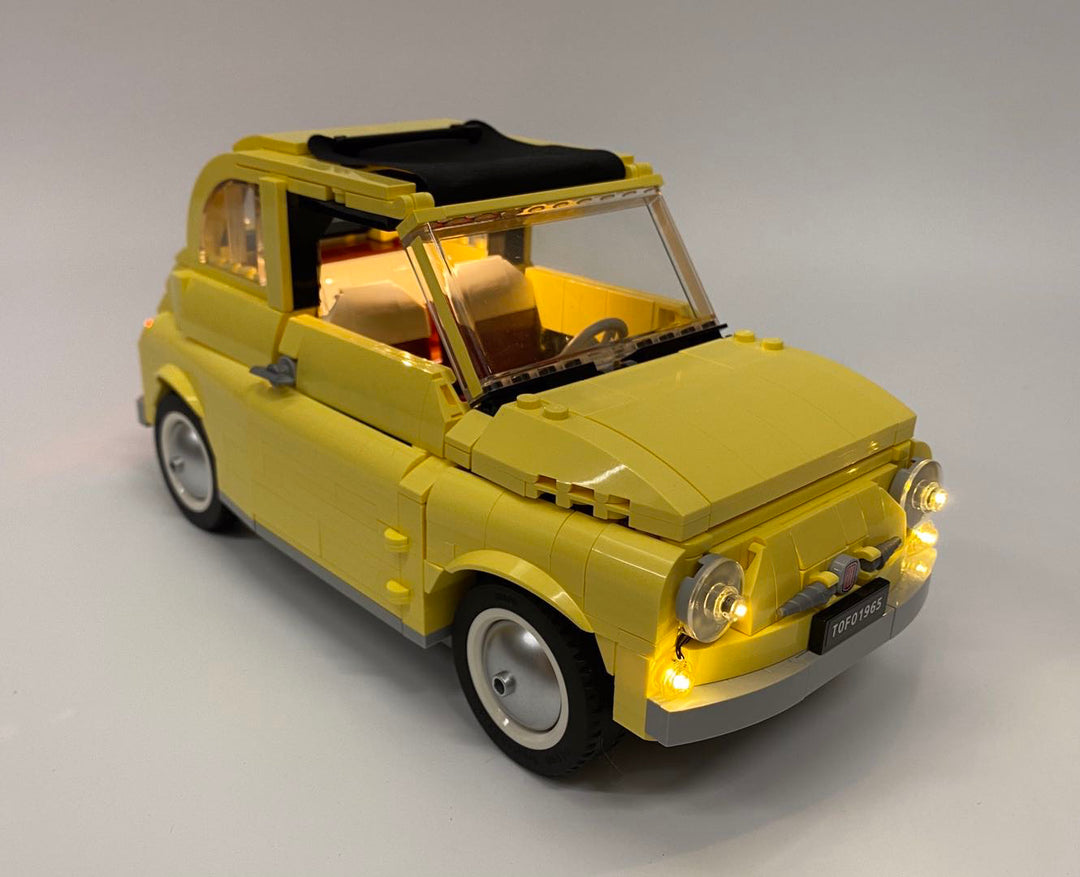 LEGO Fiat 500 set 10271 with the custom Brick Loot LED Light kit installed. Brilliant LEDs illuminate the front headlights, interior, and tail lights of the Fiat model.