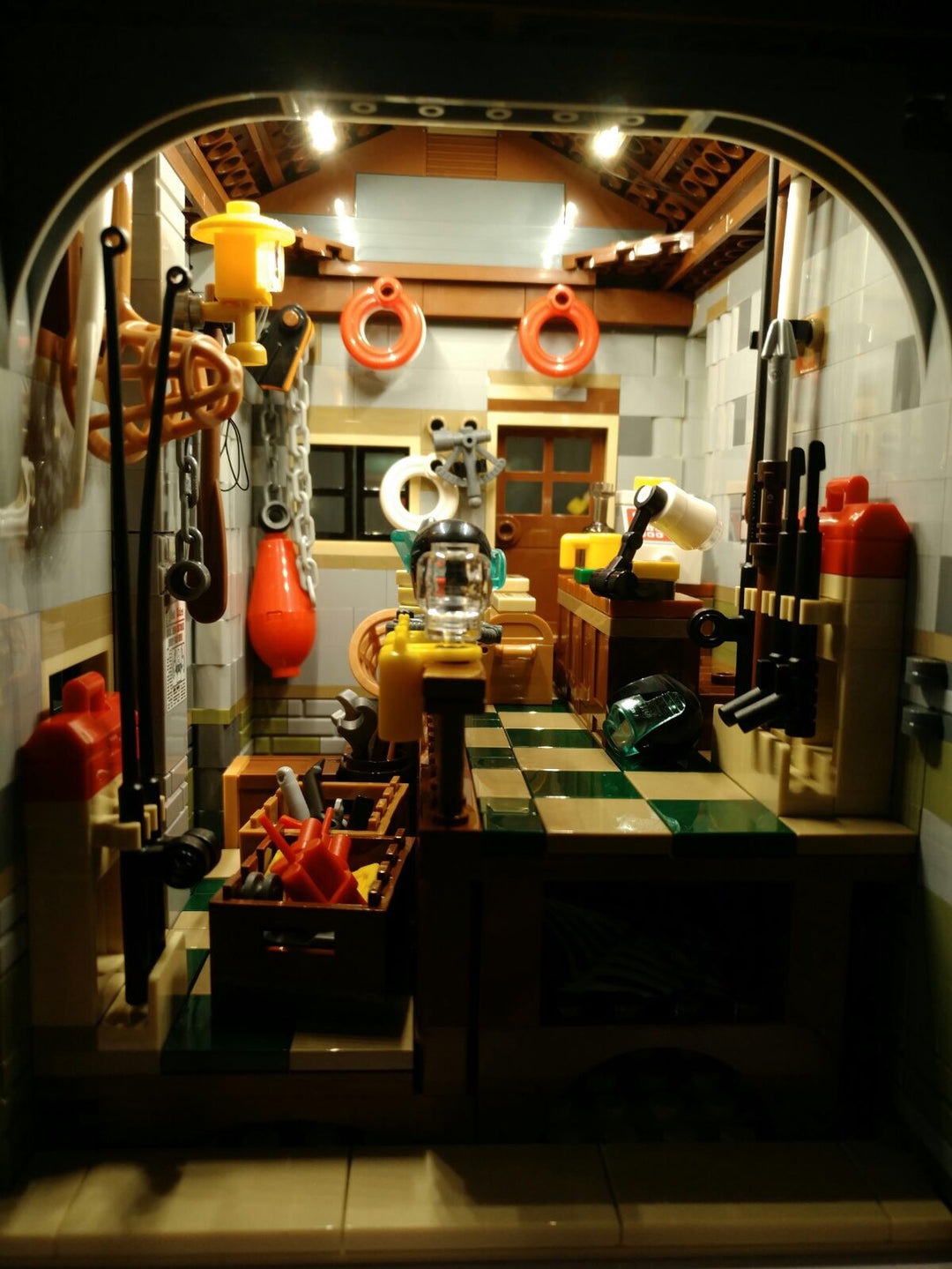 Interior of LEGO® Old Fishing Store set 21310 illuminated with Brick Loot Original Light Kit.