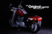 Close up of the side and rear of the LEGO Harley Davidson Fat Boy Motorcycle set 10269, illuminated with the Brick Loot custom LED kit.  