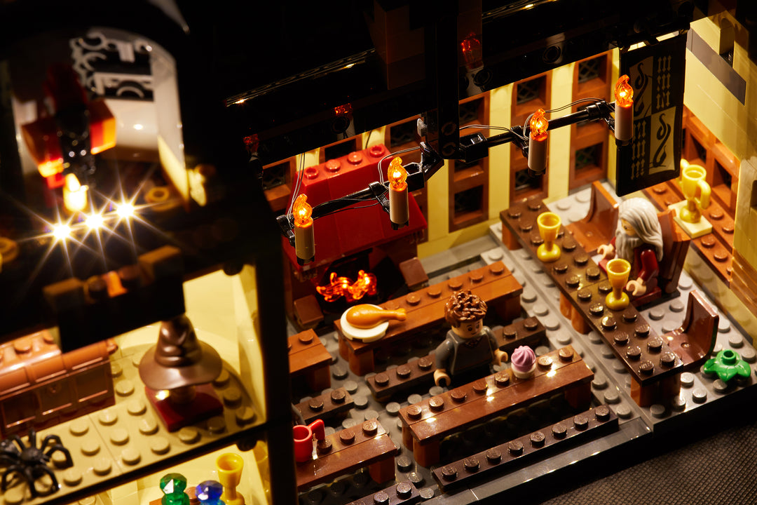 Close-up of the interior of the LEGO Hogwarts Great Hall set 75954, with the Brick Loot LED Light Kit.