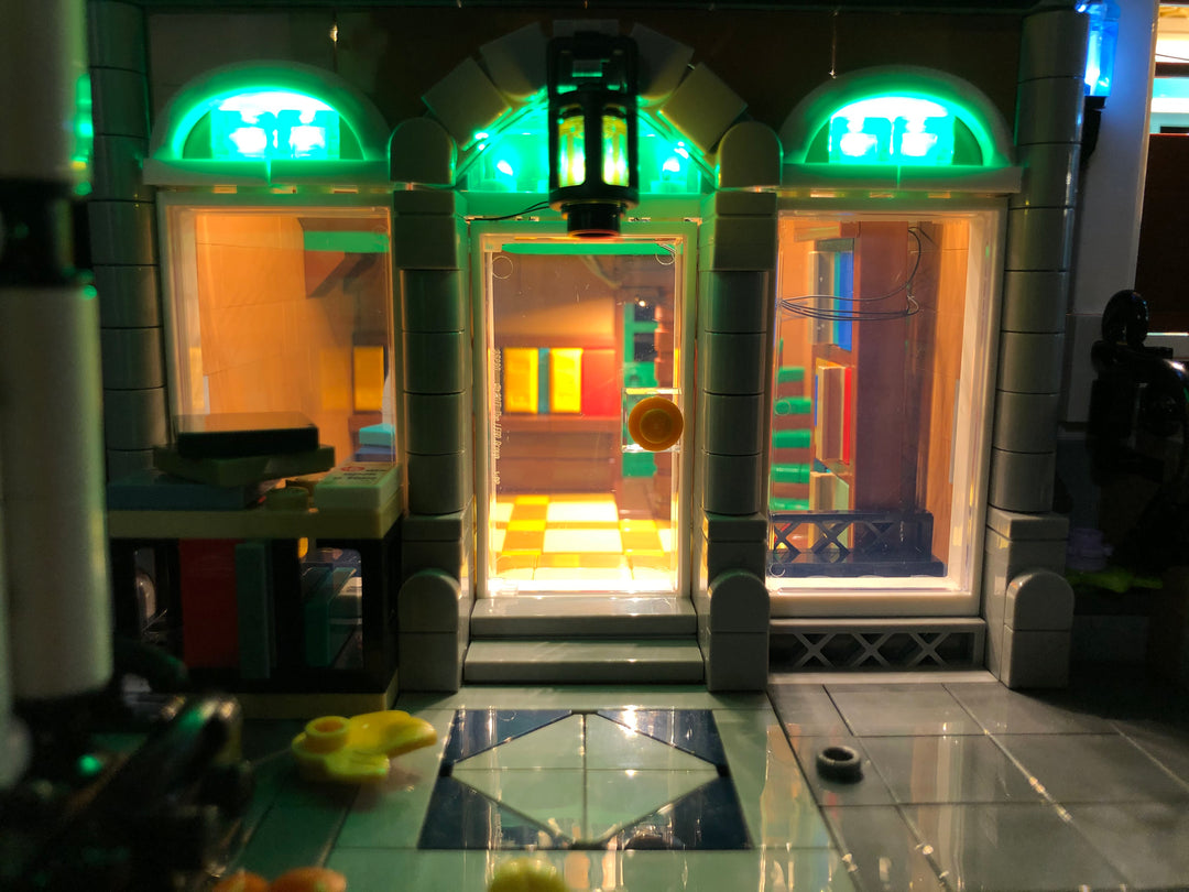 Close-up of the LEGO Createor Expert Bookshop set 10270 with the Brick Loot custom LED Lighting kit.