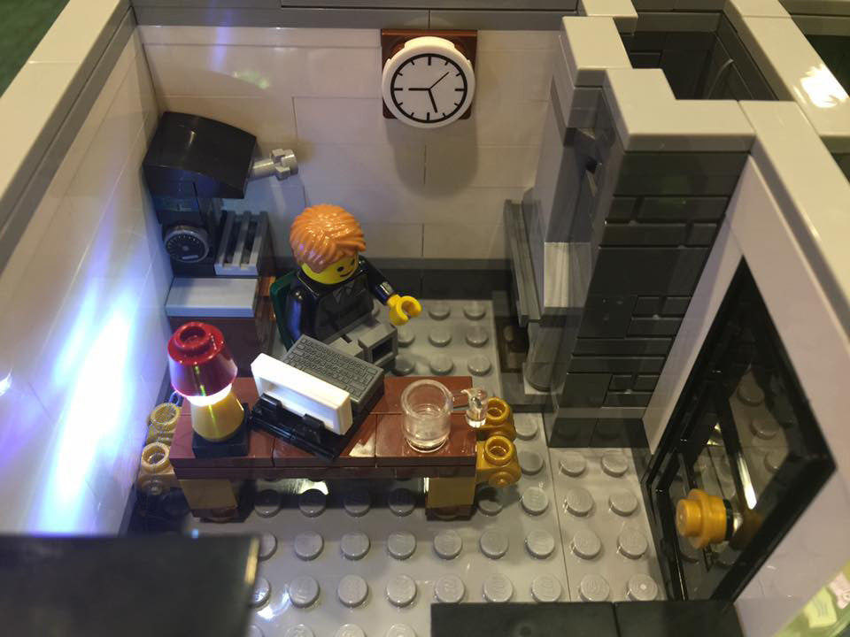 Close-up of one of the interior rooms of the LEGO Brick Bank set 10251, with the Brick Loot LED light kit installed.
