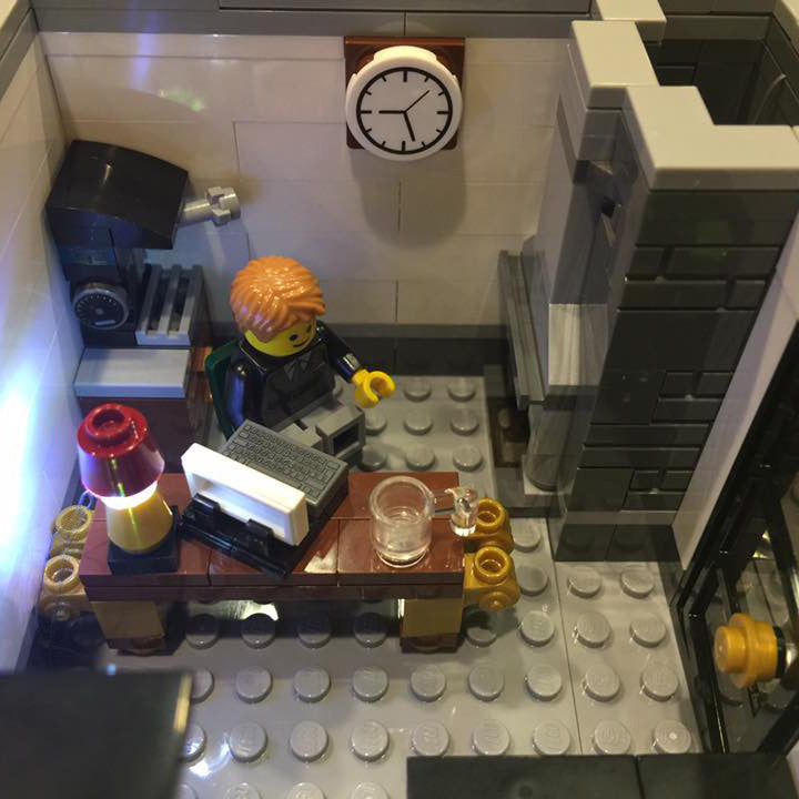 Close-up of one of the interior rooms of the LEGO Brick Bank set 10251, with the Brick Loot LED light kit installed.