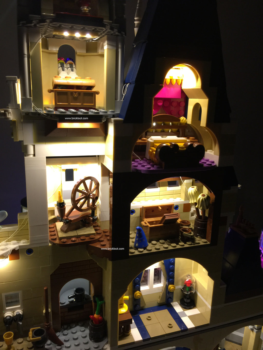Close up of the interior of some of the rooms of the LEGO Disney Castle set 71040, beautifully illuminated with the Brick Loot LED Light Kit with 105 LED lights.