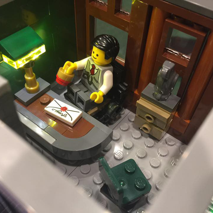 Close-up of one of the interior rooms of the LEGO Brick Bank set 10251, with the Brick Loot LED light kit installed.