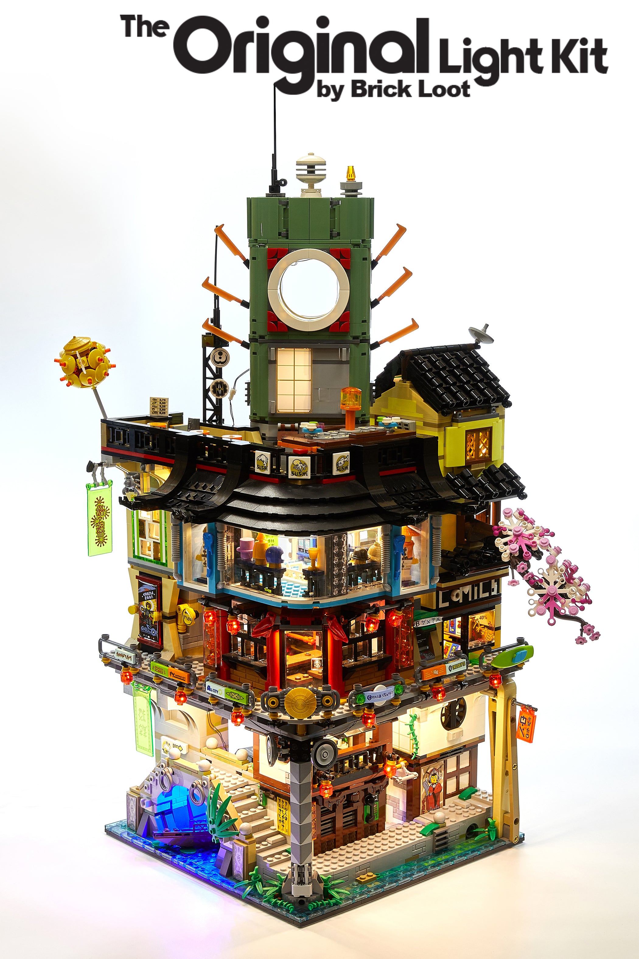 LEGO NINJAGO City set 70620, fully illuminated with the custom Brick Loot LED Light Kit.