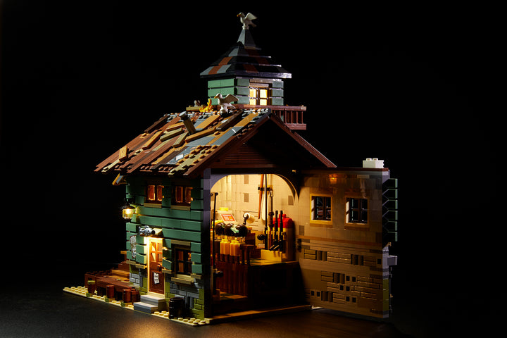 LEGO Ideas Old Fishing Store set 21310, fully illuminated with the Brick Loot LED Light Kit.