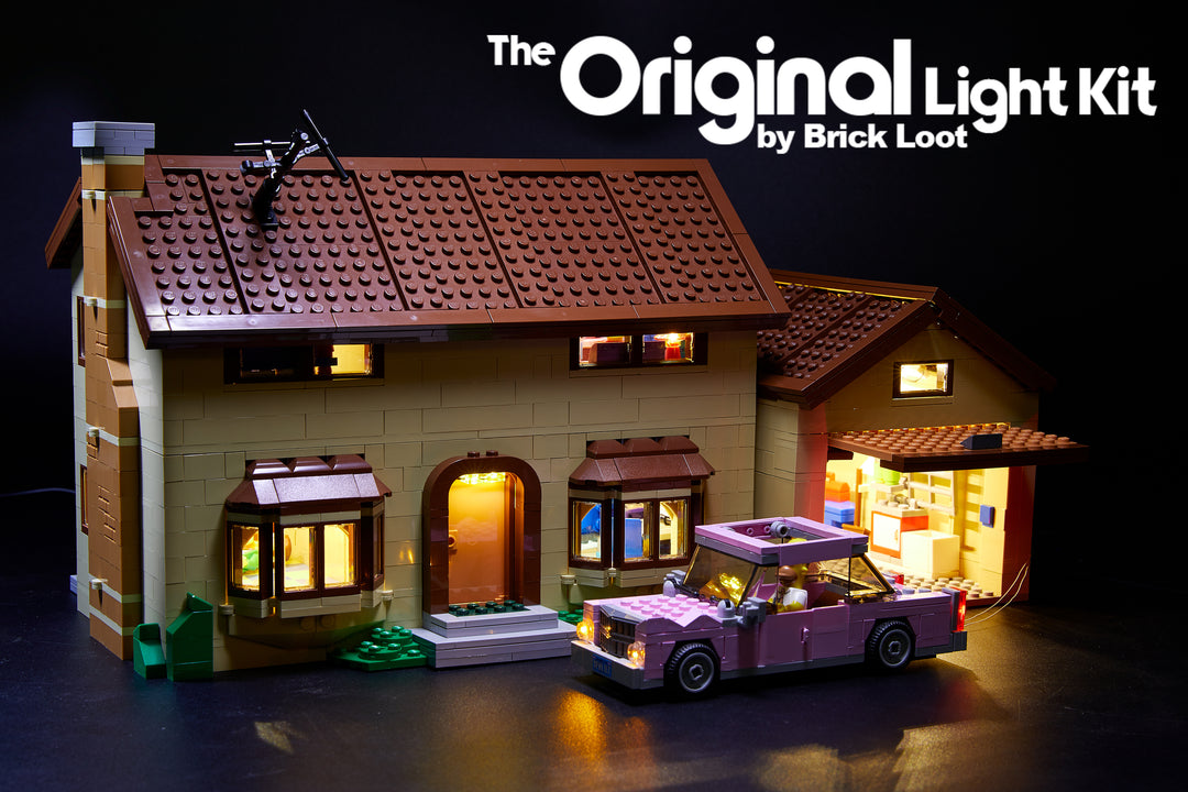 Exterior of the LEGO Simpsons House set 71006 including Homer's car, illuminated with the Brick Loot LED Light Kit.