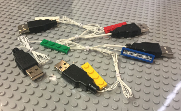 Brick Loot Light Kit for LEGO - 1x4 Brick Down Lights in White/White LED, Red/Red LED, Green/Green LED, Blue/Blue LED, Yellow/yellowish-tint LED; all USB-powered. Each sold separately or as a 5-pack.