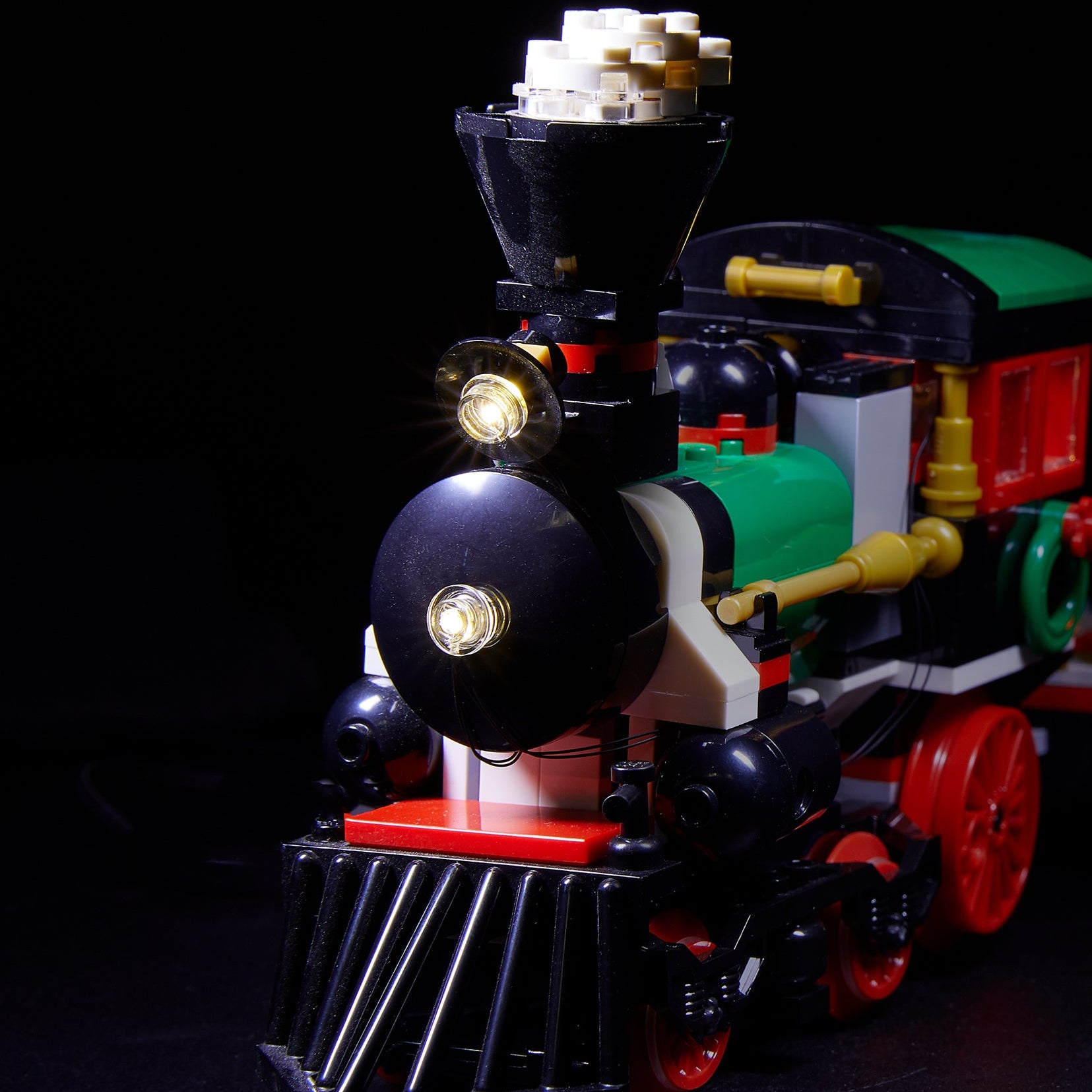 Front of the LEGO Winter Holiday Train set 10254 with Brick Loot LED light kit installed. Brilliant during the day and at night!