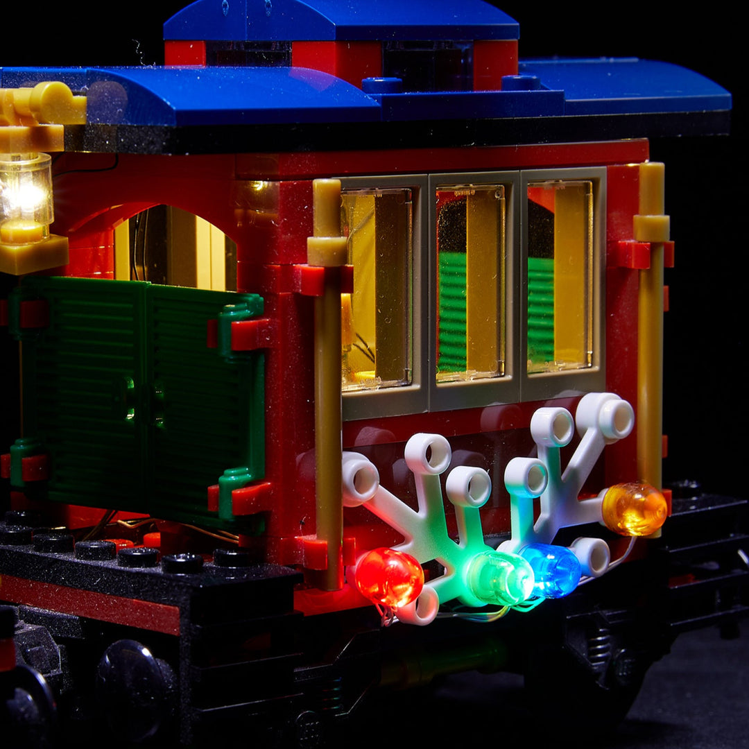 The passenger car of the LEGO Winter Holiday Train set 10254 with Brick Loot LED light kit installed. Brilliant during the day and at night!