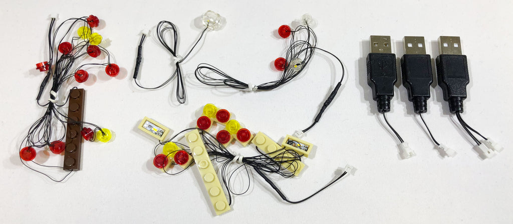 USB-powered LED strings for the custom light kit for the LEGO Winter Village Post Office set 10222, custom designed by Brick Loot. Light strings connect to the USB with mini plugs.