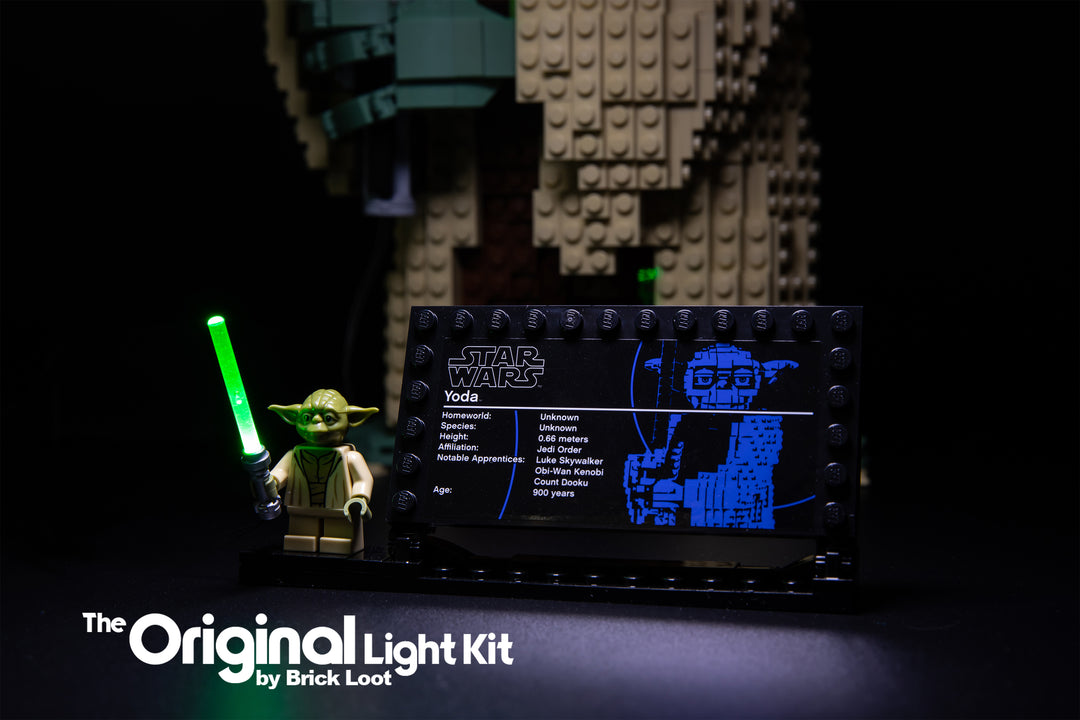 Close up of the LEGO® Yoda minifigure with glowing lightsaber (from the Brick Loot LED Light Kit). This is part of the LEGO Star Wars Attack of The Clones Yoda Building Model and Collectible Minifigure with Lightsaber set 75255.
